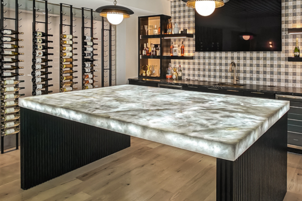 Basement bar with expansive countertop and built‑in bottle rack
