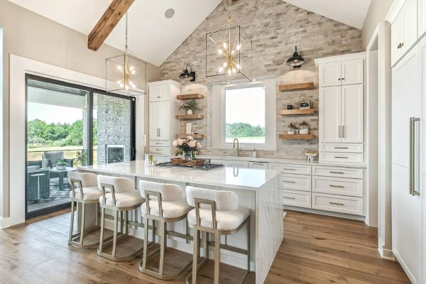 Quartz kitchen island with seating and stainless steel stove in Leavenworth Kansas home