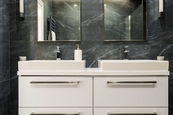 Dark granite bathroom with cabinet